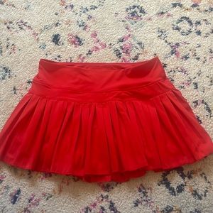 red gold hinge tennis skirt
